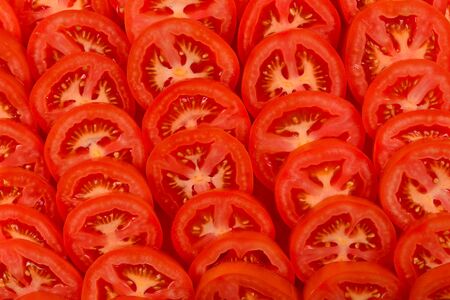 Sliced tomato background. Top view.