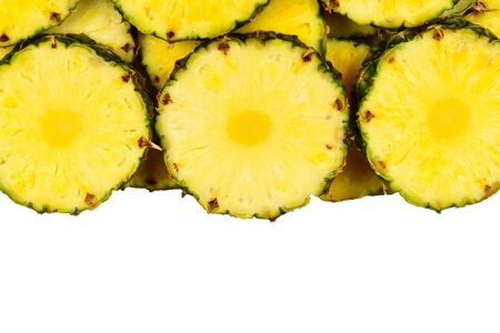Pineapple juicy yellow slices background. Top view.の写真素材