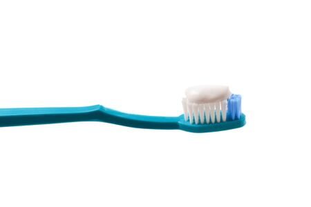 Toothbush with toothpaste on a white background. 
