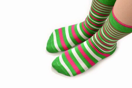 Woman in green socks isolated on white background. Top view.の写真素材