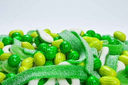Assorted green gummy candies background. Top view. Jelly  sweets.の写真素材