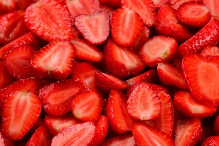 Strawberry slices. Fresh berries macro. Fruit background. Top view.の写真素材