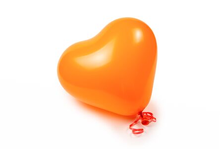 Orange heart ballon isolated on white background. Copy space.の写真素材