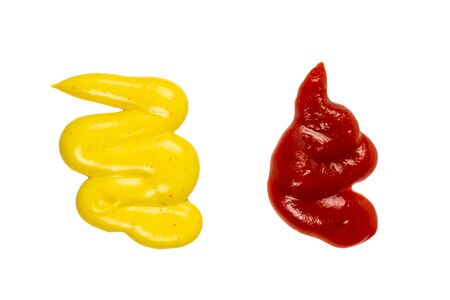 Ketchup and yellow sauce splashes isolated on white background.の写真素材