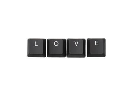 Word love written on keyboard. Isolated on white. Top view. 