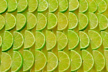 Fresh lime slices as a background. の写真素材