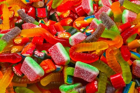 Assorted tasty gummy candies. Top view. Jelly  sweets background.の写真素材