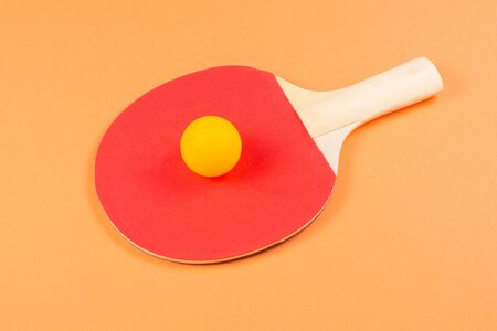 Pin pong on an orange background.  Top view.の写真素材
