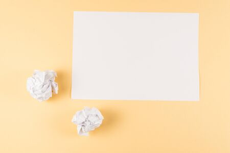 White empty sheet of paper on beige background. Copy space. の写真素材