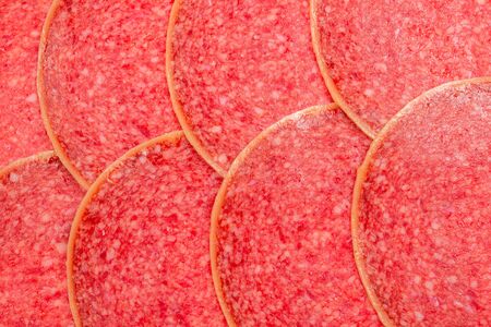 Tasty salami slices background. Top view.の写真素材