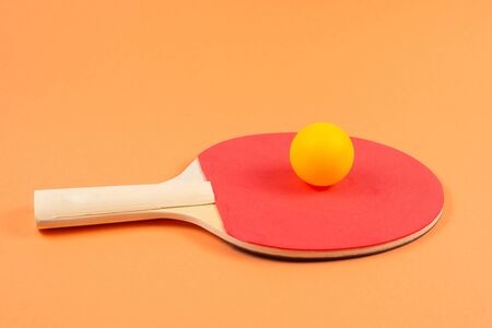 Table tennis on an orange background.  Top view.