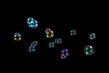 Soap bubbles isolated on a black backgroundの写真素材