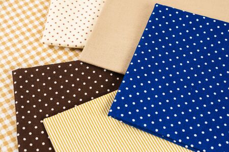 Mix of beige, white and brown cotton fabric. Top view.の写真素材