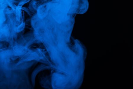 Blue steam on a black background. Copy space.の写真素材