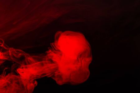 Red steam on a black background. Copy space.の写真素材