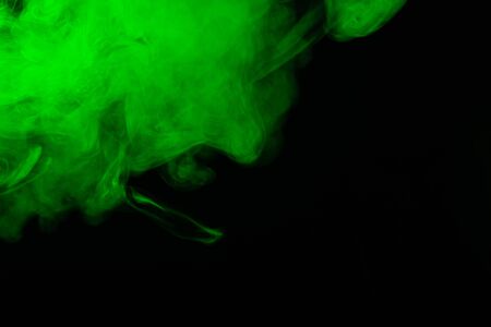 Green steam on a black background. Copy space.の写真素材