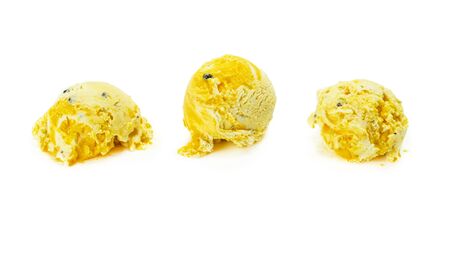 Passion fruit ice cream ball isolated on white.の写真素材