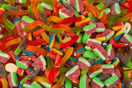 Assorted tasty gummy candies. Top view. Jelly  sweets background.の写真素材