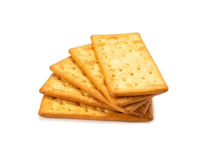 Cracker with salt isolated on white. Top view.の写真素材