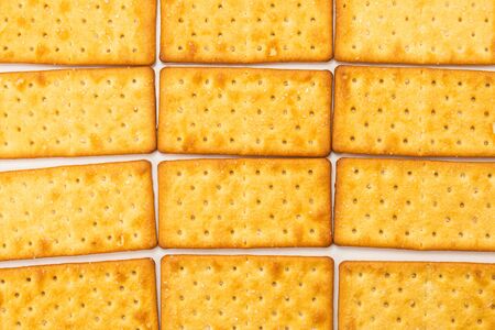 Cracker with salt isolated on white. Top view.の写真素材