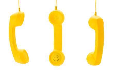 Yellow handset isolated on white. Copy space.の写真素材