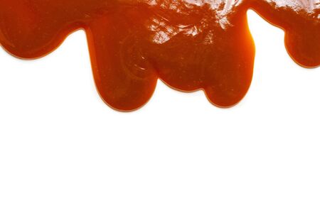 Background of flowing caramel sauce isolated on white. Copy space.の写真素材