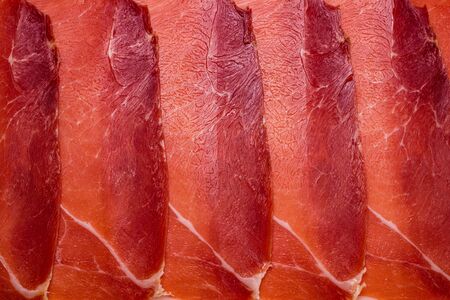 Tasty meat background, thinly sliced jamon. Top view. の写真素材