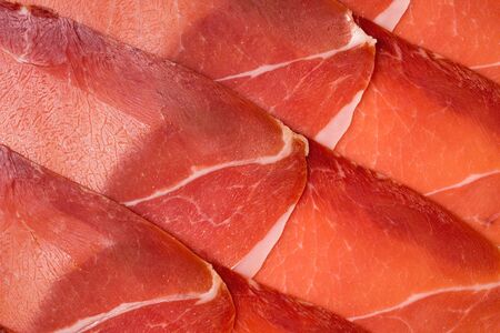Tasty meat background, thinly sliced jamon. Top view. の写真素材