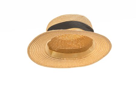 Straw hat with black bow isolated on white background. の写真素材