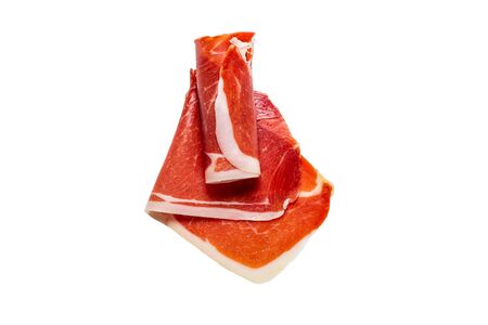 Thinly sliced jamon isolated on white background. Top view. の写真素材