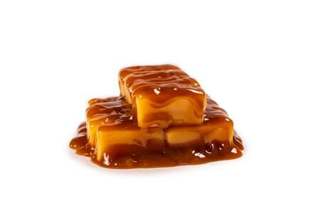Tasty caramel candy isolated on white background. Copy space.の写真素材