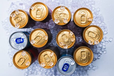 Group of aluminium cans in ice, cold drink. Top view.の写真素材