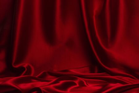Red silk or satin luxury fabric texture can use as abstract background. Top viewの写真素材