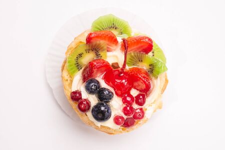 Home made cake with cream and fruits isolated on white. 