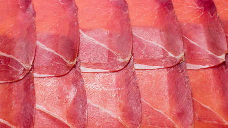 Tasty meat background, thinly sliced jamon. Top view.の写真素材
