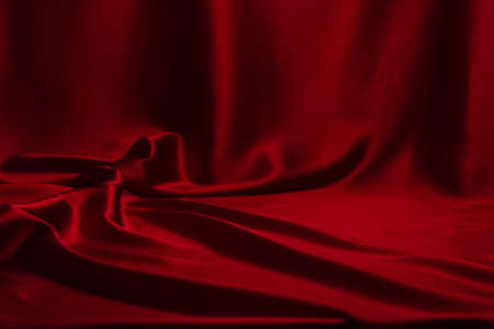 Red silk or satin luxury fabric texture can use as abstract background. Top viewの写真素材