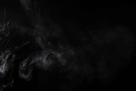 White steam on a black background. Copy space.の写真素材