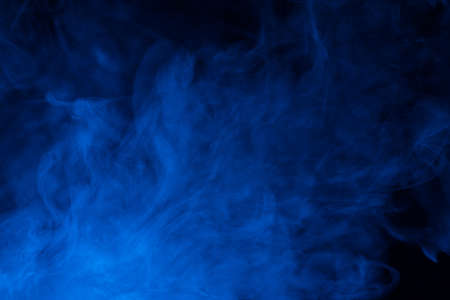 Blue steam on a black background. Copy space.の写真素材
