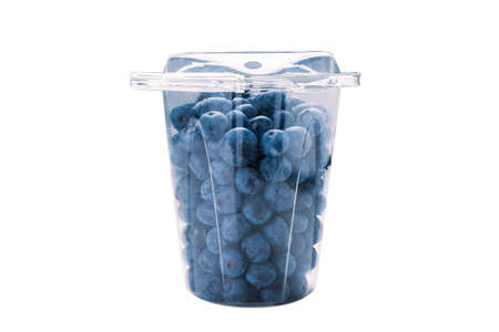 Blueberries in a plastic container isolated on white background.の写真素材