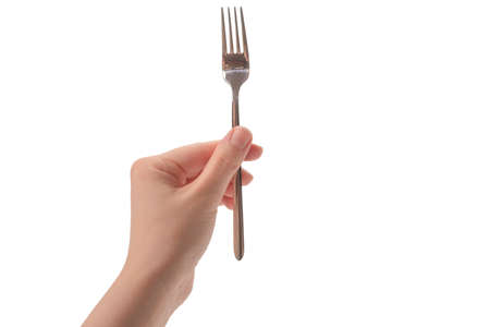Fork in woman hand isolated on white background.