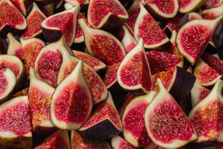 Tasty figs background. Top view. Slices.の写真素材