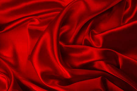 Red silk or satin luxury fabric texture can use as abstract background. Top view.の写真素材