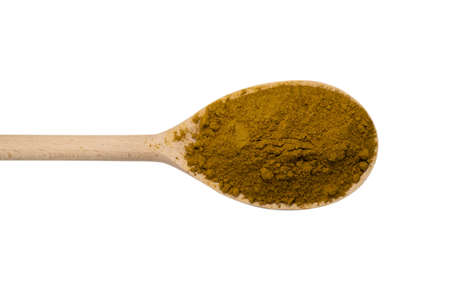 Curry in wooden spoon isolated on white background. Top view.の写真素材