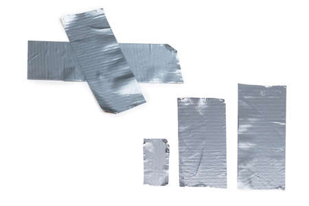 Silver scotch tape pieces isolated on white background. Top view.