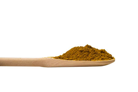 Curry in wooden spoon isolated on white background.の写真素材