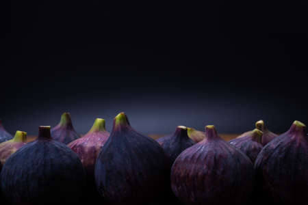 Tasty figs on a black background. Top view. Slices.の写真素材