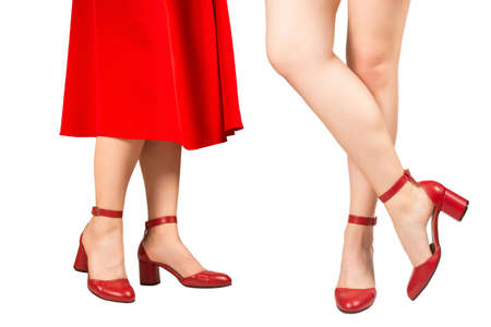 Woman legs in retro red sandals on heels isolated on white background.の写真素材