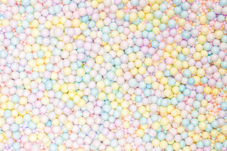 Purple, yellow, blue plastic balls background.の写真素材