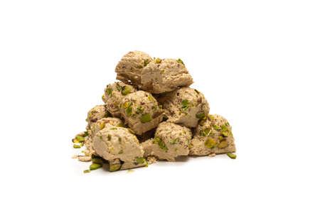 Halva with pistachios isolated on white background.