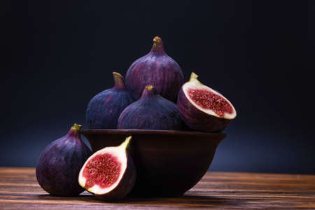 Tasty figs on a black background. Top view. Slices.